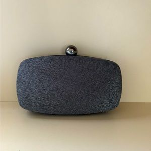 Shimmering gunmetal colored evening bag.